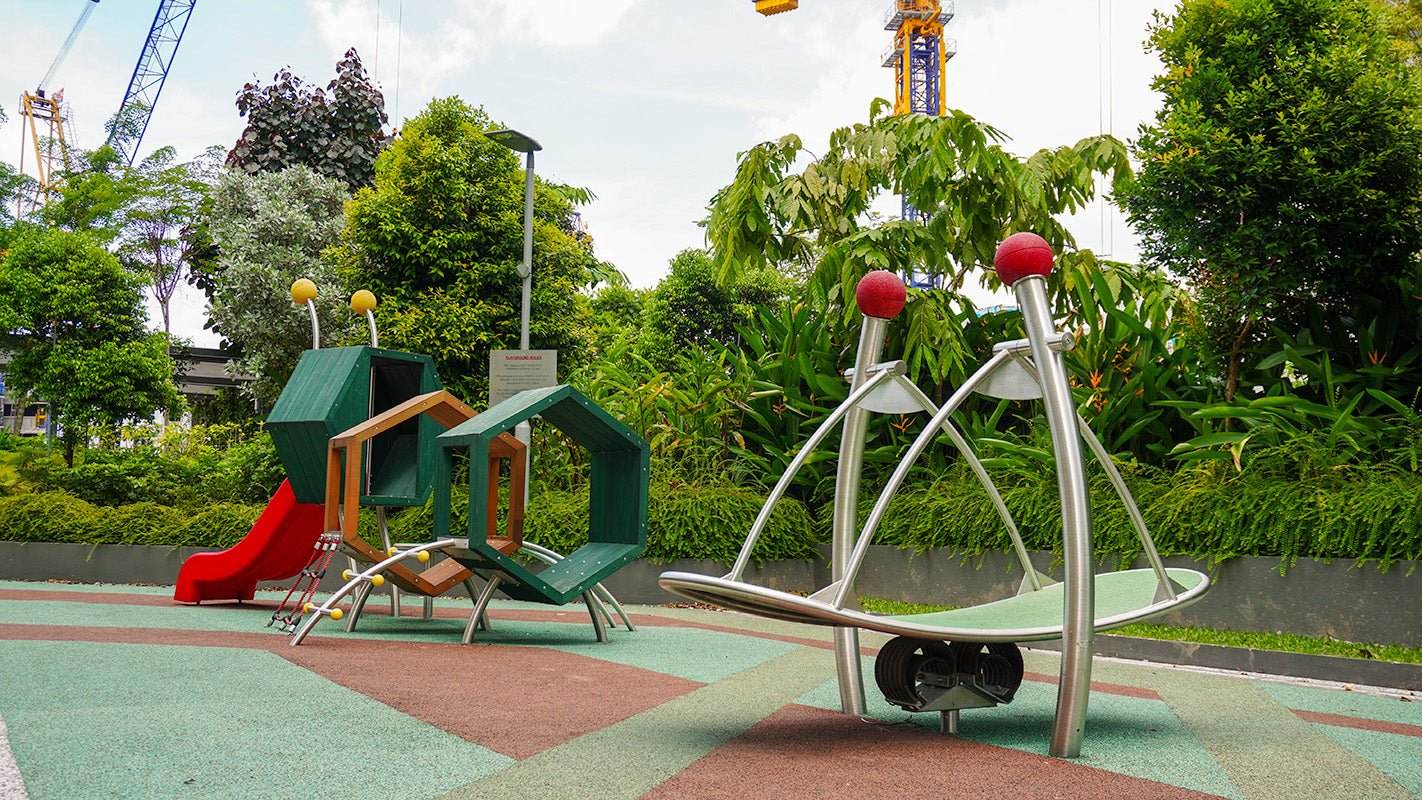 Stilum playground equipment designed to enhance children's motor skills and curiosity through interactive play.