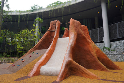 Mandai Rainforest Resort features Buttress tree-inspired playground equipment for adventurous climbing and sliding fun.