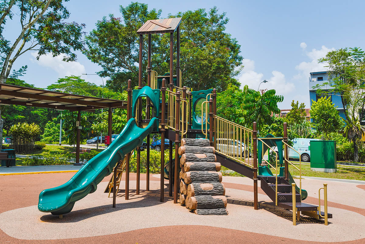 Meng Suan Interim Park features a nature-inspired Playworld playground, blending seamlessly with lush surroundings.