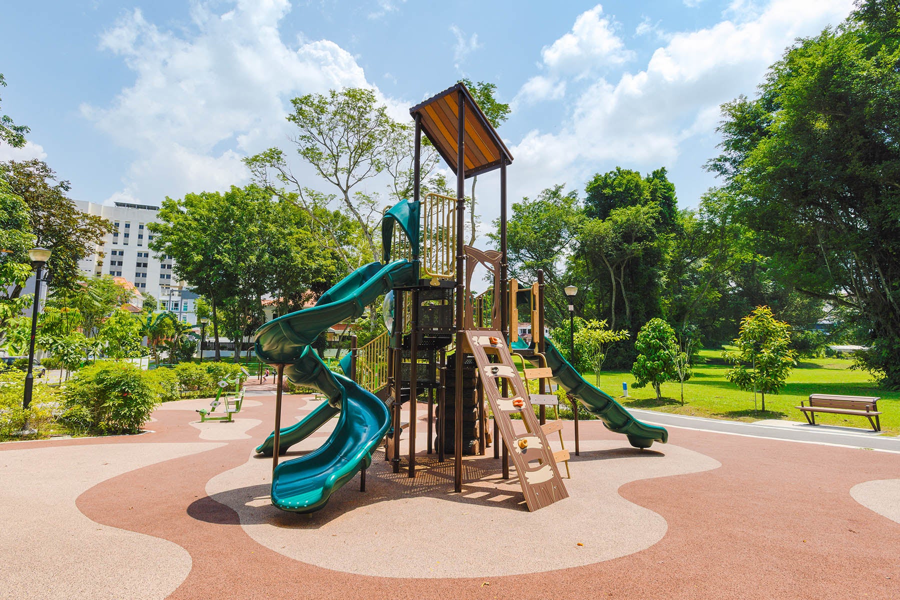 Meng Suan Interim Park features a nature-inspired Playworld playground, blending seamlessly with lush surroundings.