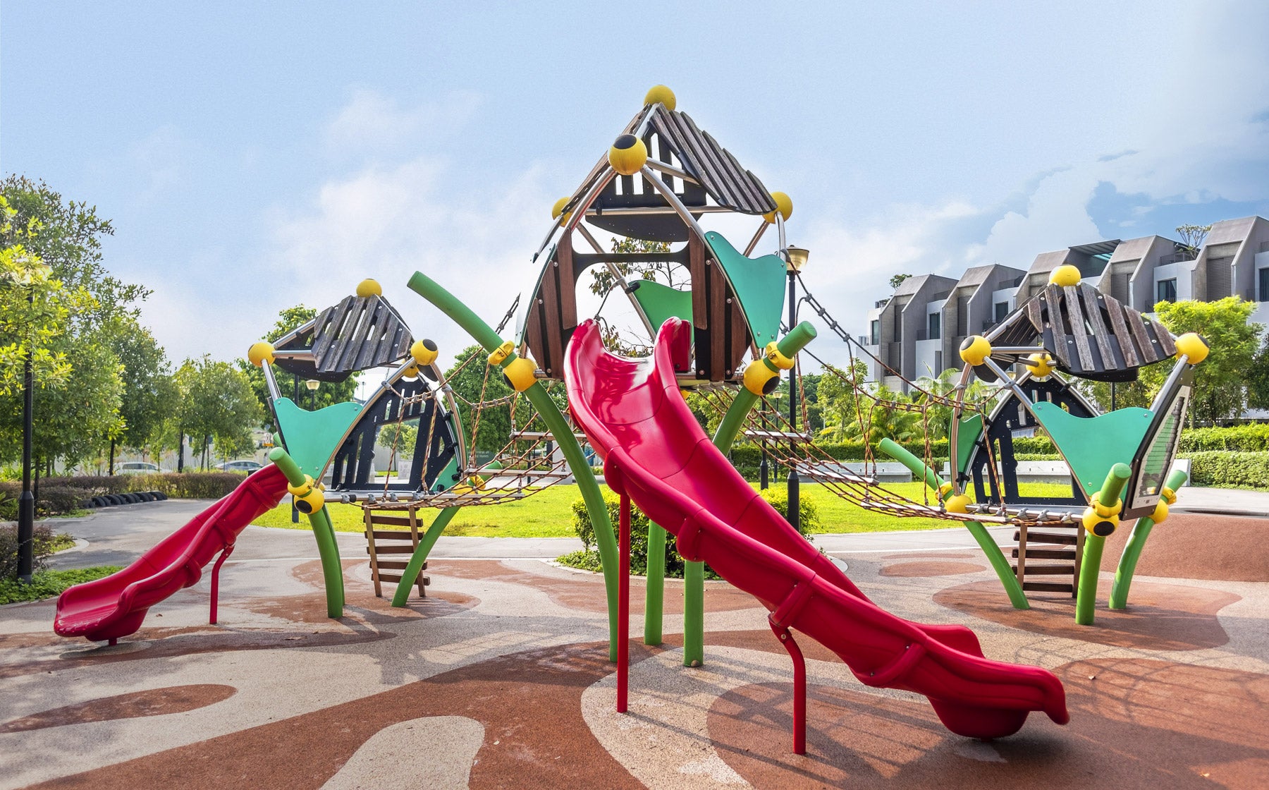 Nim Meadow Park Berliner playground with Greenville structures, rope nets, ladder, and suspension bridge for adventure.