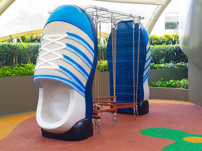 Shoe-shaped equipment creates a balance climber that allows children to practice their balancing skills.