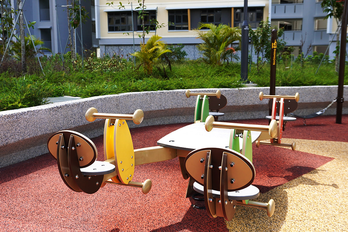 Playworld four-person see-saw promotes teamwork, social interaction and motor skill development through play.