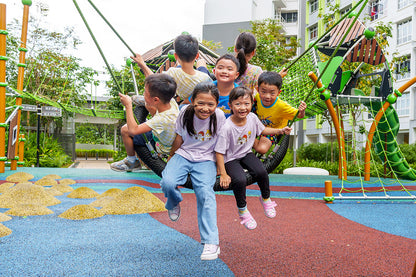 Children on a Berliner Palmetto Saucer swing, promoting teamwork and cooperation while enjoying shared play and fun.