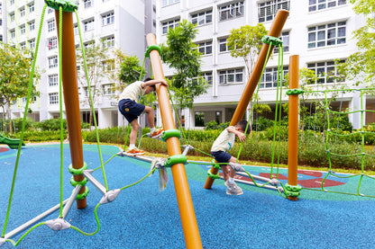 Children navigating the obstacle course at Yishun Melody Spring playground, engaging in fun and adventurous play.