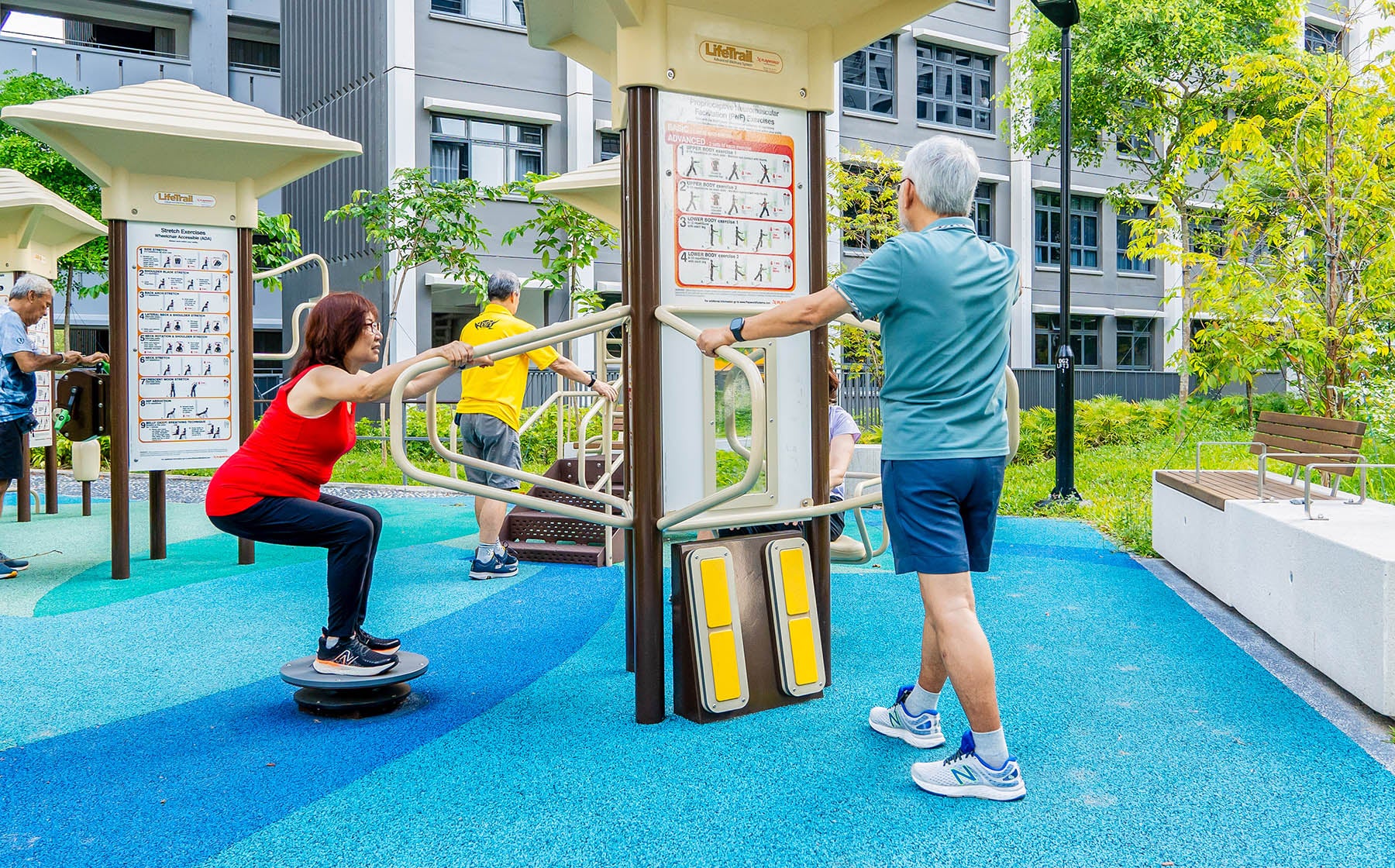 Fitness corner with elderly individuals exercising happily on outdoor equipment, promoting health and community bonding.