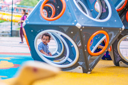 The little boy is eagerly exploring the Playworld PlayCube.