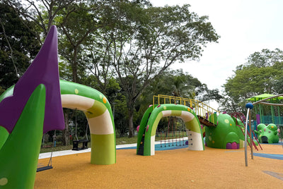 Sea Shell Park Sea Dragon playground features a climbing net and swings for active, adventurous children's play.
