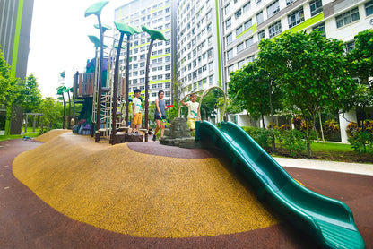 
Child preparing to slide down a playground slide, designed with safety features for a fun and secure play experience.