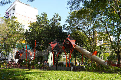 Berliner Greenville Trii treehouses linked by rope tunnels create a connected elevated play adventure.