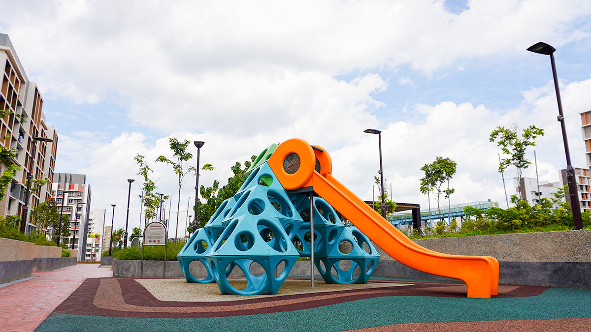 Tengah Plantation Acres playground features Playworld's Spacecube slide structure, offering climbing and sliding fun.